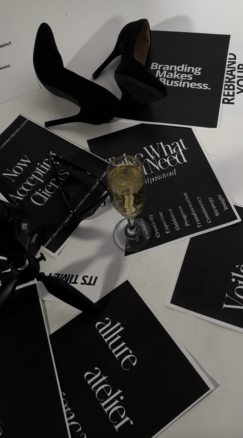 Scattered papers on the ground, each with a different statement and a glass of wine in the middle
