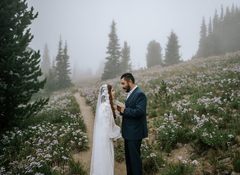 washington elopement photographer at mount rainier, bride and groom share vows silver forest trail