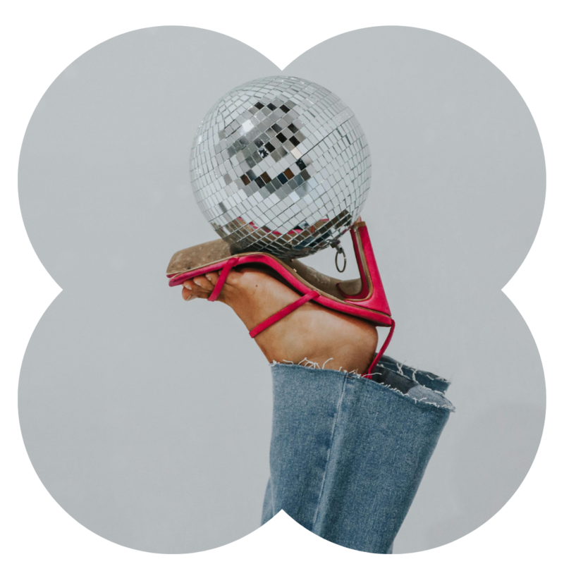 Disco Ball held up with pink heels