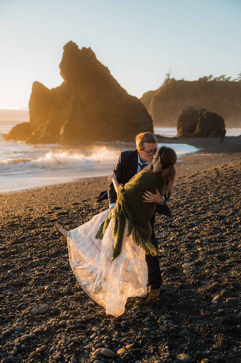 Couple eloping at sunset at Ruby Beach in Olympic National Park