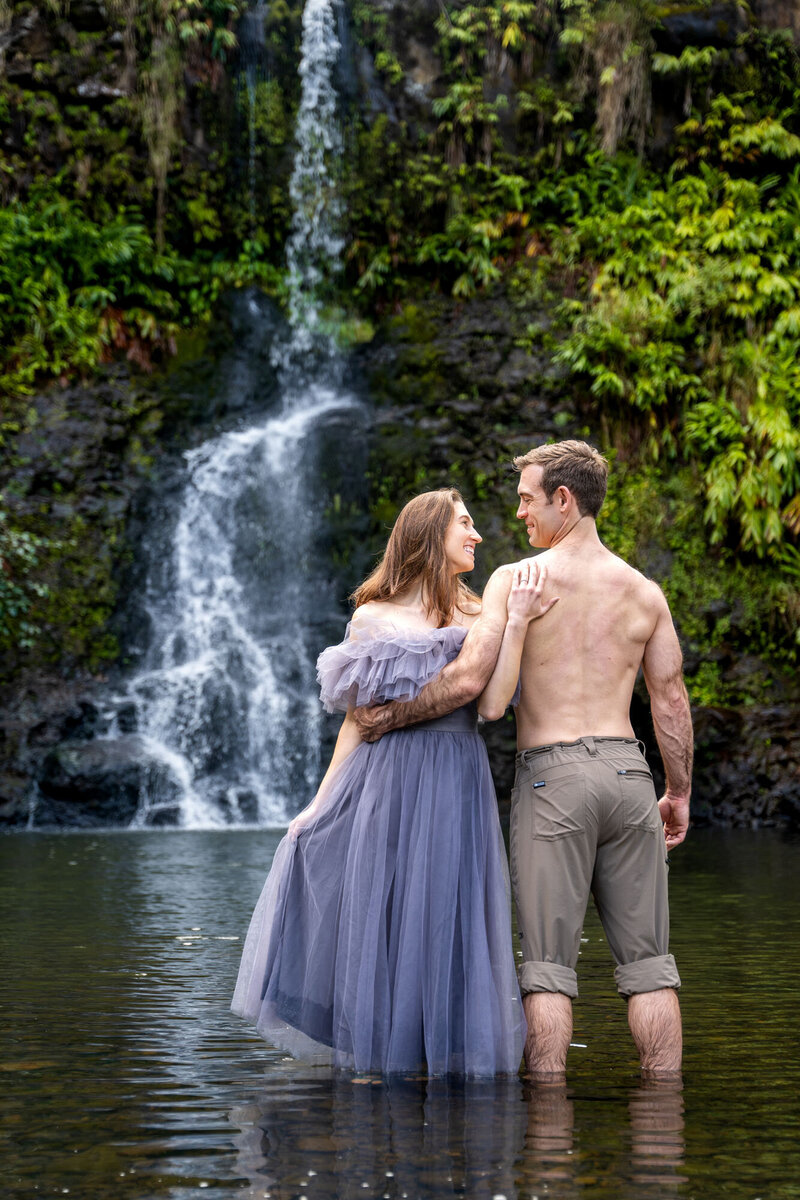 Couple in front of water fall taken by one of the best Big Island photographers