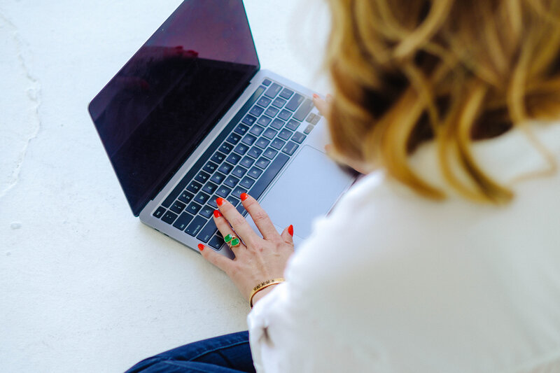 woman hands typing on computer