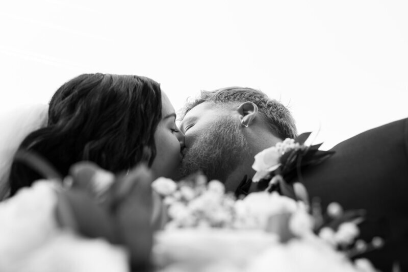 close up of bride and groom kissing by 35mm film wedding photographer Noble Photo Co
