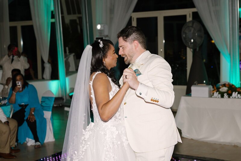Married couple happily doing their first dance