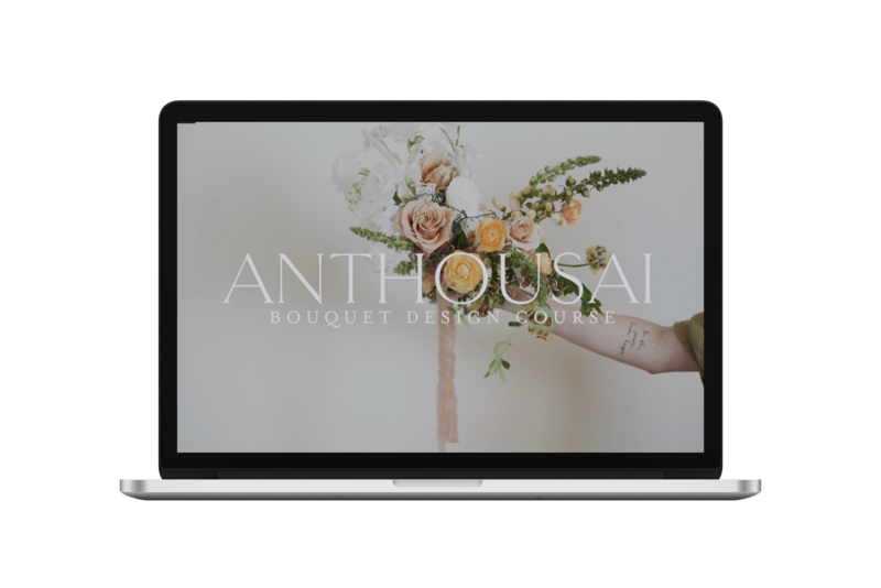 An open laptop with a screenshot of an Anthousai bouquet
