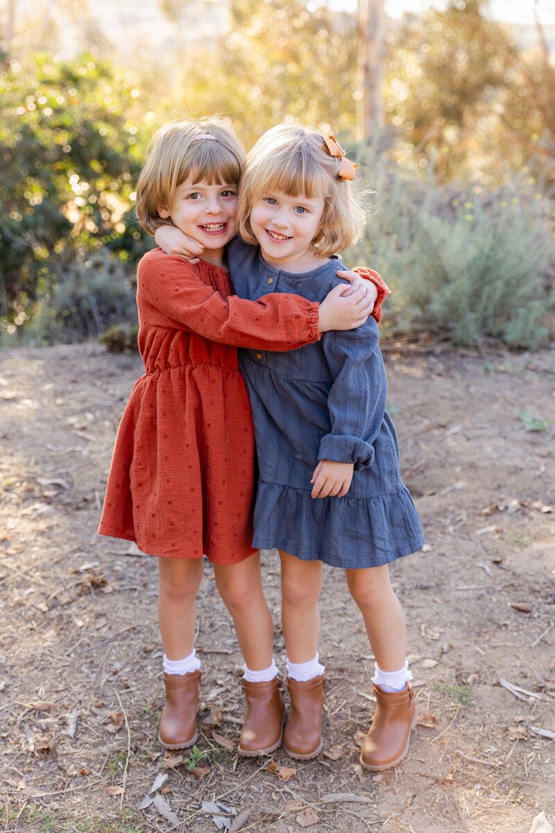 natural light photography of twin girls hugging in Culver City, CA