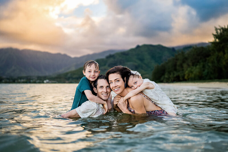 Family portrait in the water at the beach