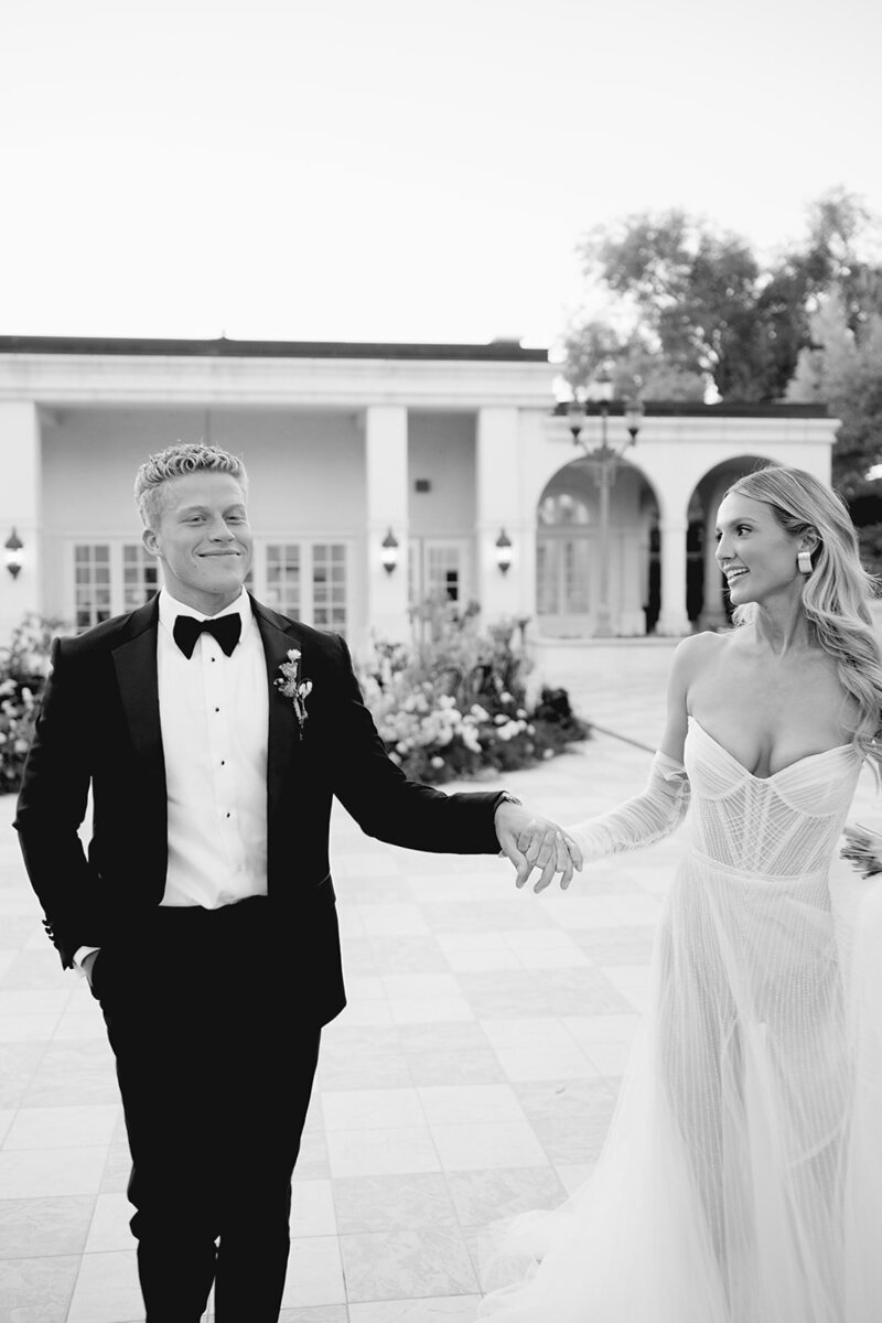bride and groom walk together out of utah wedding ceremony