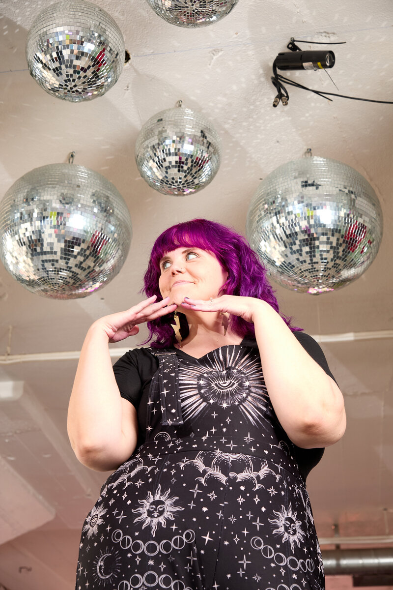 Photo of colorful website design queen, Megan Gersch, smiling