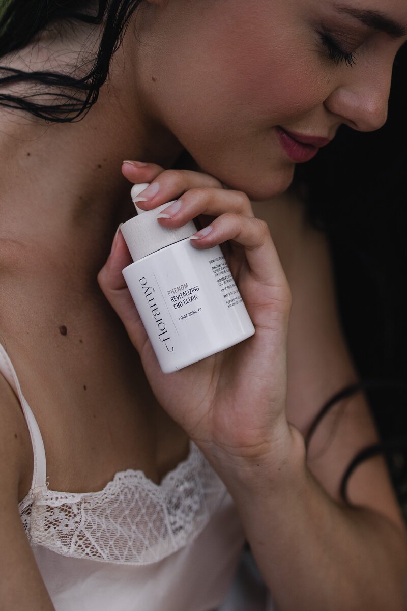 Conscious product photography of certified organic CDB Elixir by Florayme shot by Alex Perry at Lake Luisa 