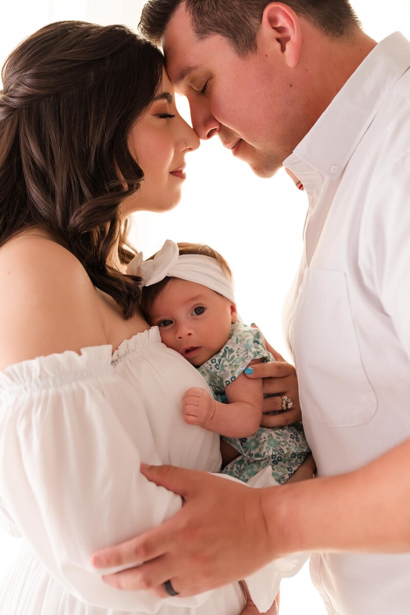 orlando newborn photographer with parents and baby
