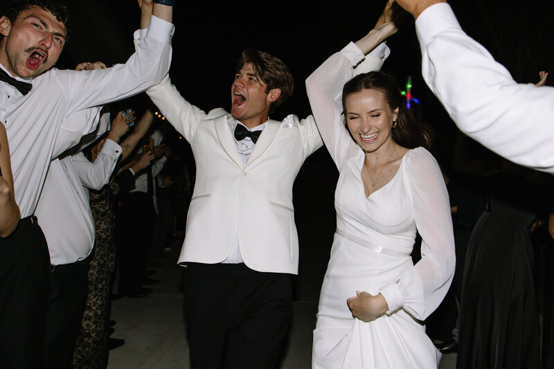 Payton and Evan exiting their wedding.