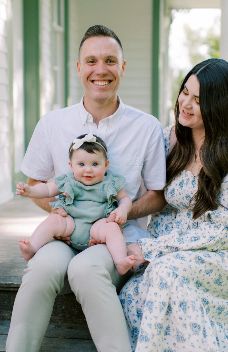 home photos of  mom and dad with baby