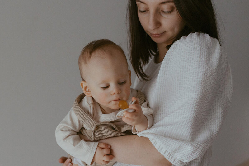 Mother holding her little child at their home in Helsinki