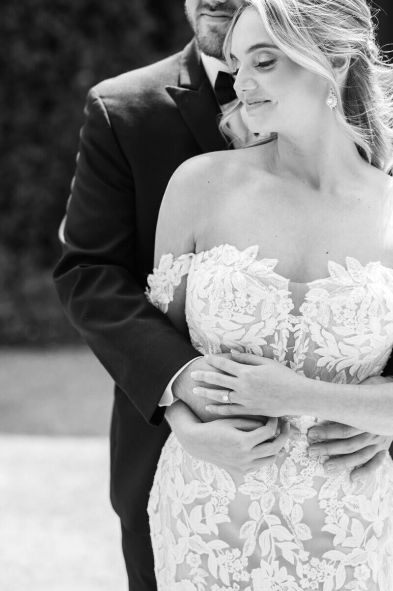Cincinnati wedding photography of black and white image of bride and groom embracing 