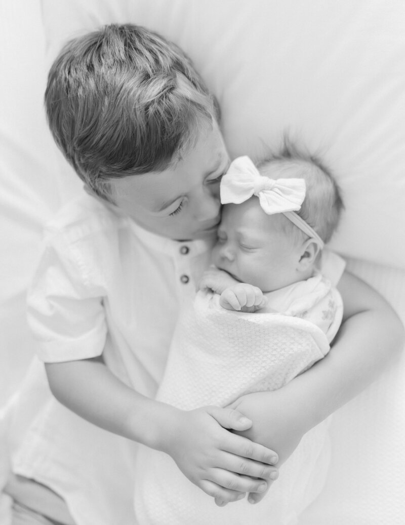 South Jordan Utah at-home newborn portraits with gentle light and classic white tones.