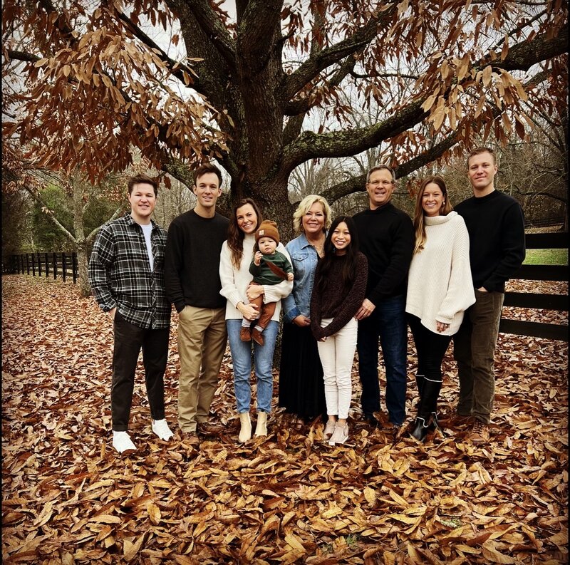 Kemp family under tree in fall