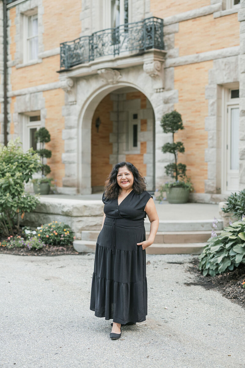 Latina brooklyn wedding photographer, Patricia Parrales, wearing black dress.