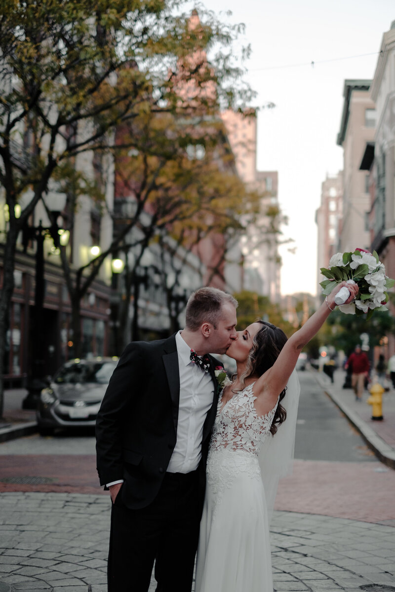Bride and groom kissing in downtown Providence, Providence wedding