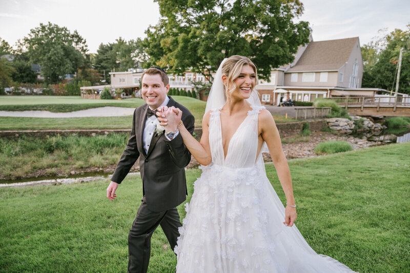 A classic and timeless wedding  photo featuring a kiss and a cathedral vail on the dock at Bonnet Island Estate 