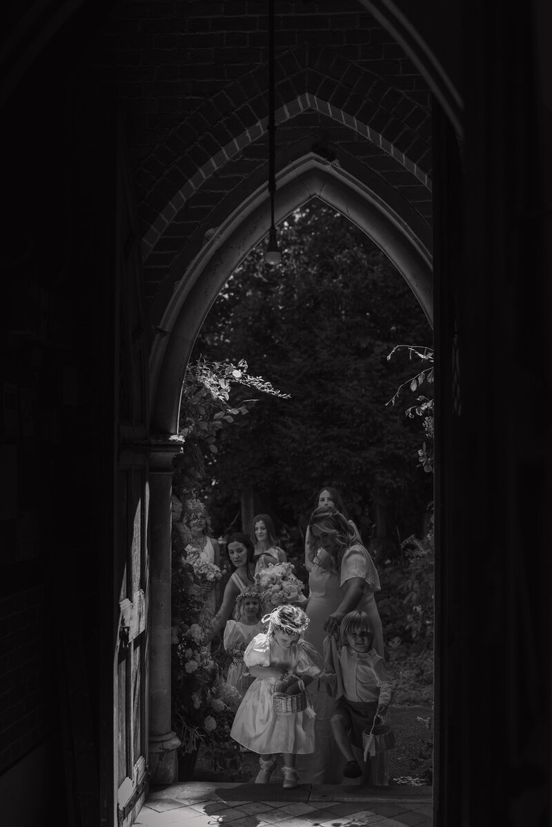 Wedding photographer captures couple taking a stroll hand in hand at their french chateau wedding.