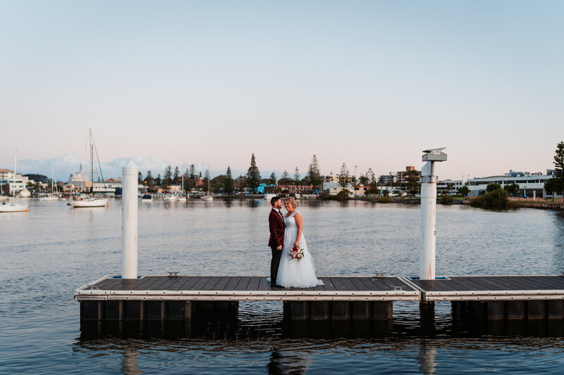 Couple photoshoot in their wedding attire at the port