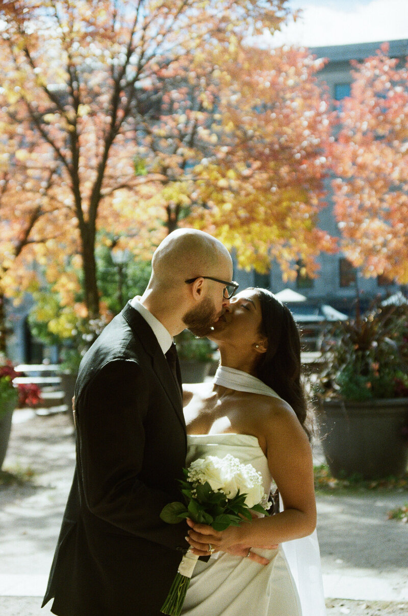 A timeless black-and-white portrait of a newlywed couple in Montreal, capturing raw emotions and elegant details with a film-inspired touch.