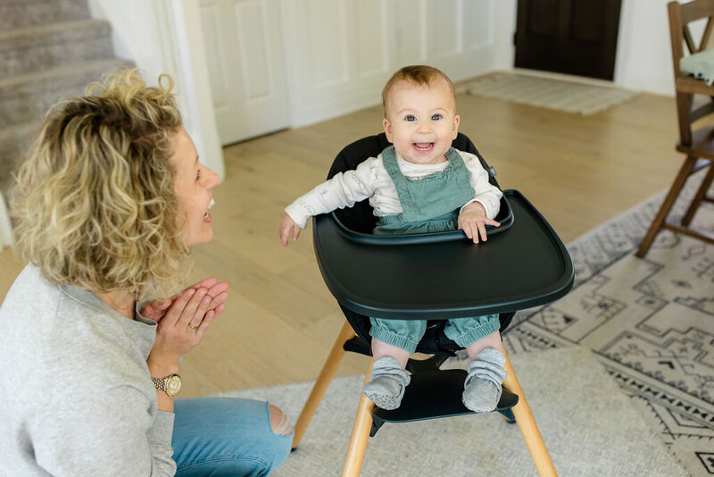baby sitting in high chair