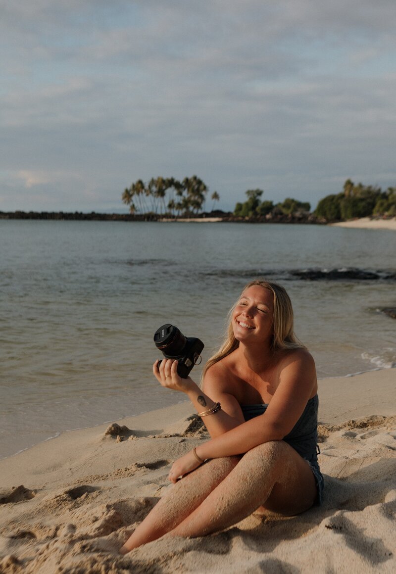 melly joy smiling at the camera on beach on oahu