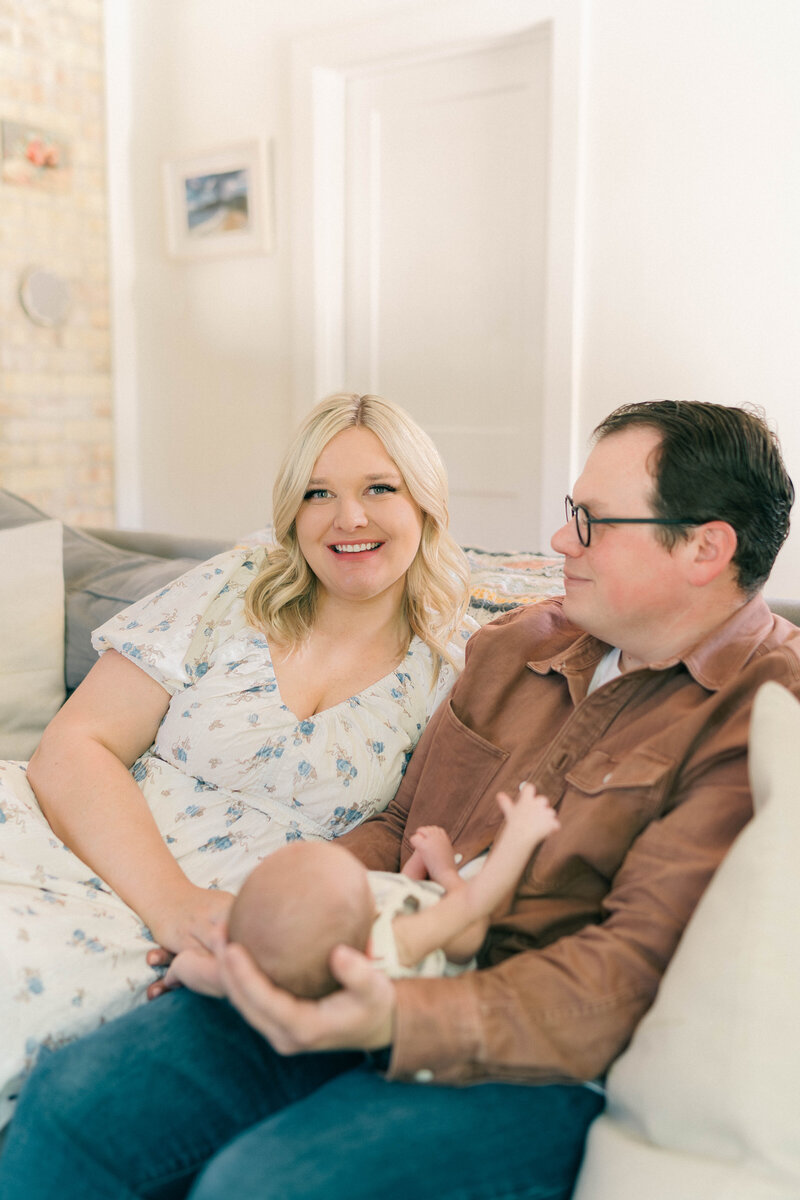 Lifestyle newborn photography at home in MillCreek, Utah by Iris Graciela Photography. Natural light and soft, delicate imagery capturing the connection between baby and family.