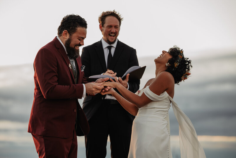 Wedding ceremony with couple laughing at their elopement in North Carolina