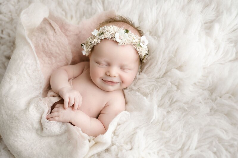 newborn girl sleeping on peach fuzzy blanket } newborn photographer pittsburgh