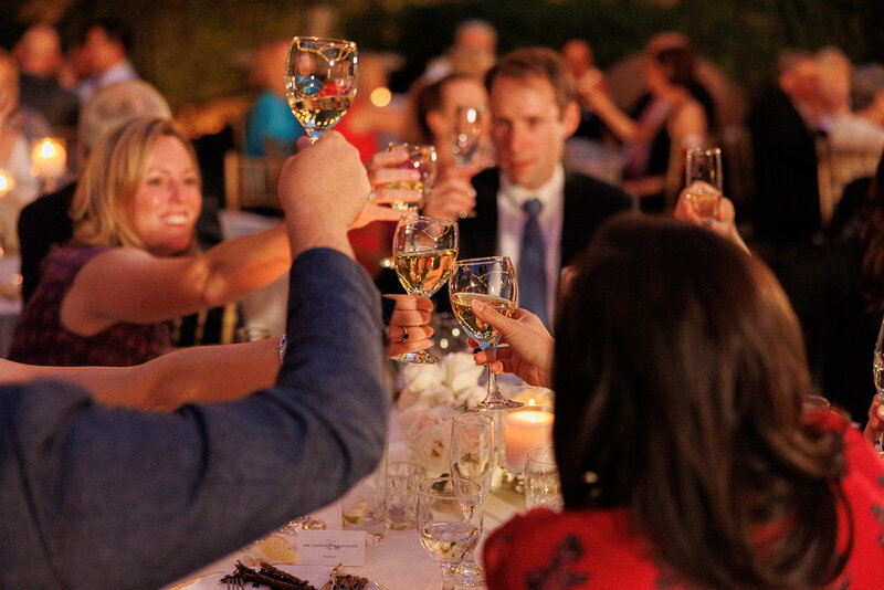 wedding guests cheers with champagne at the reception