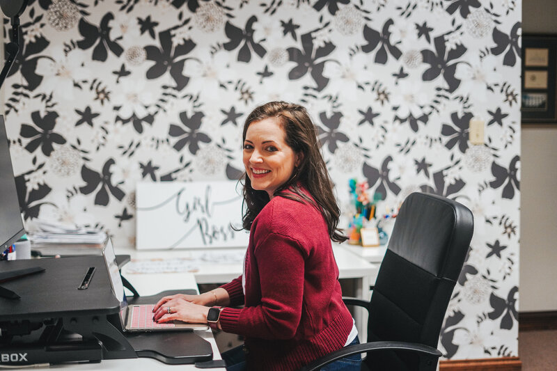 women sitting with computers at desk