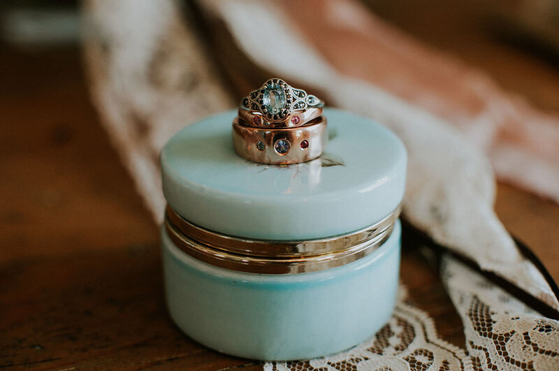 wedding rings stacked on top of ring box