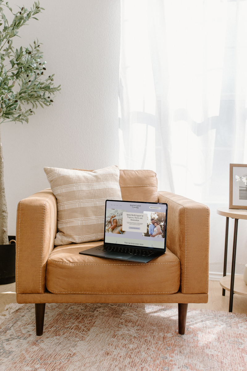 Cozy workspace with chair and laptop for brand and web design.