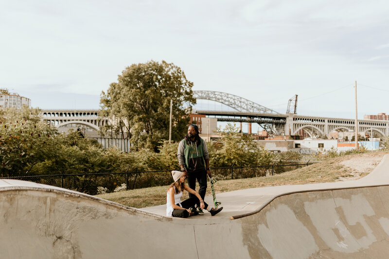 A DC couple skates at a skate park in the city