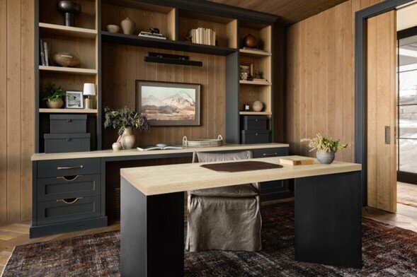 A well-organized home office featuring a desk and shelves, creating a productive and inviting workspace.