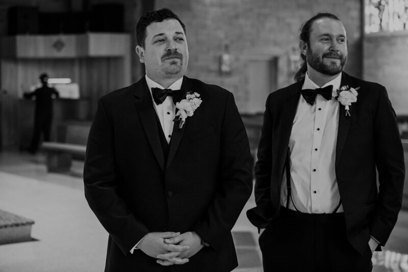 Two people in suits standing together
