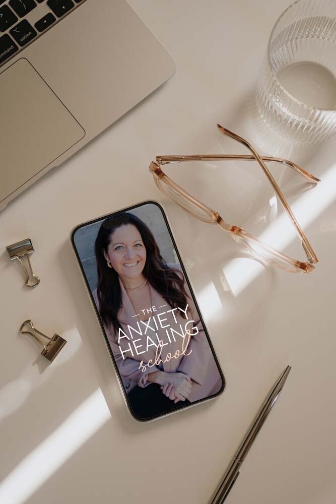 phone on desk with anxiety school logo