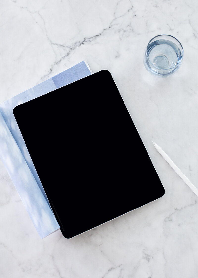 iPad and blue notebook