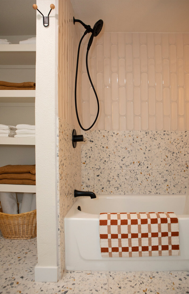 A bathroom with custom tiles and details by interior designer Erin in Portland Oregon.