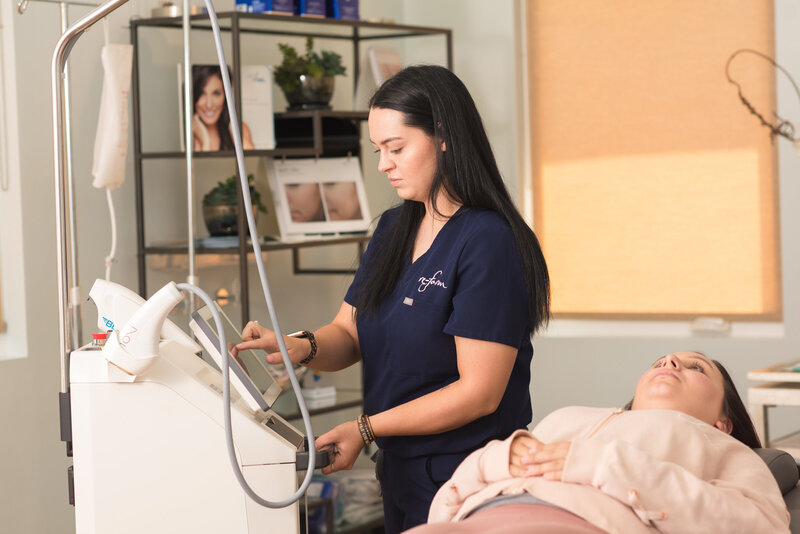 Nurse preforms a cosmetic procedure on a client