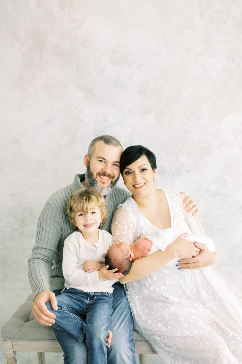 Image of Nashville Family Photographer Dolly DeLong Photographer with her Husband and two sons and the photo is by Lindsay Reed Photography