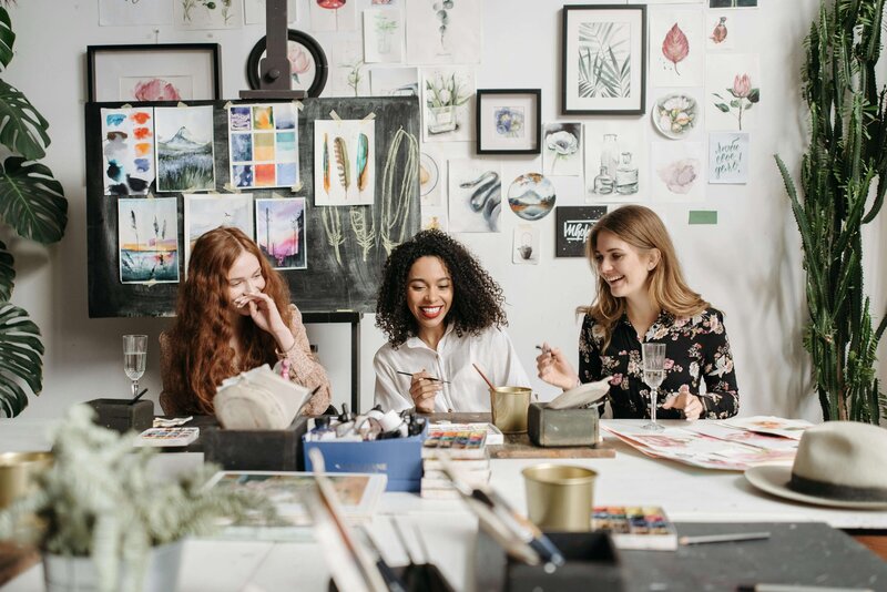 Women laughing and creating art