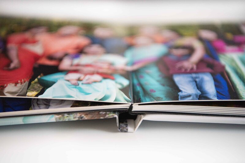 Showcase large family portraits in a photo book