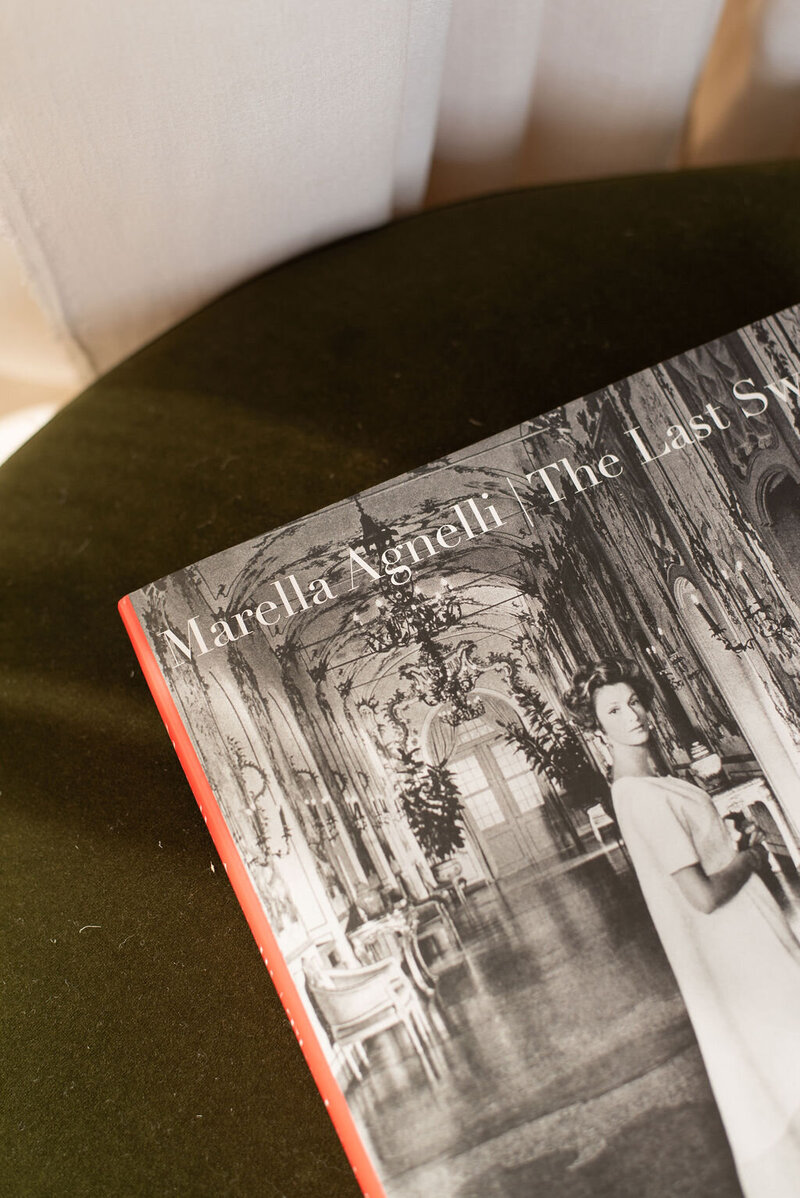 A closed book by Marella Agnelli on a green ground