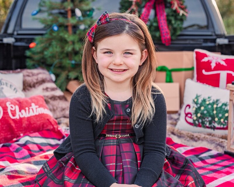 Family photos in Jacksonville, Florida on a farm with kids in a swing