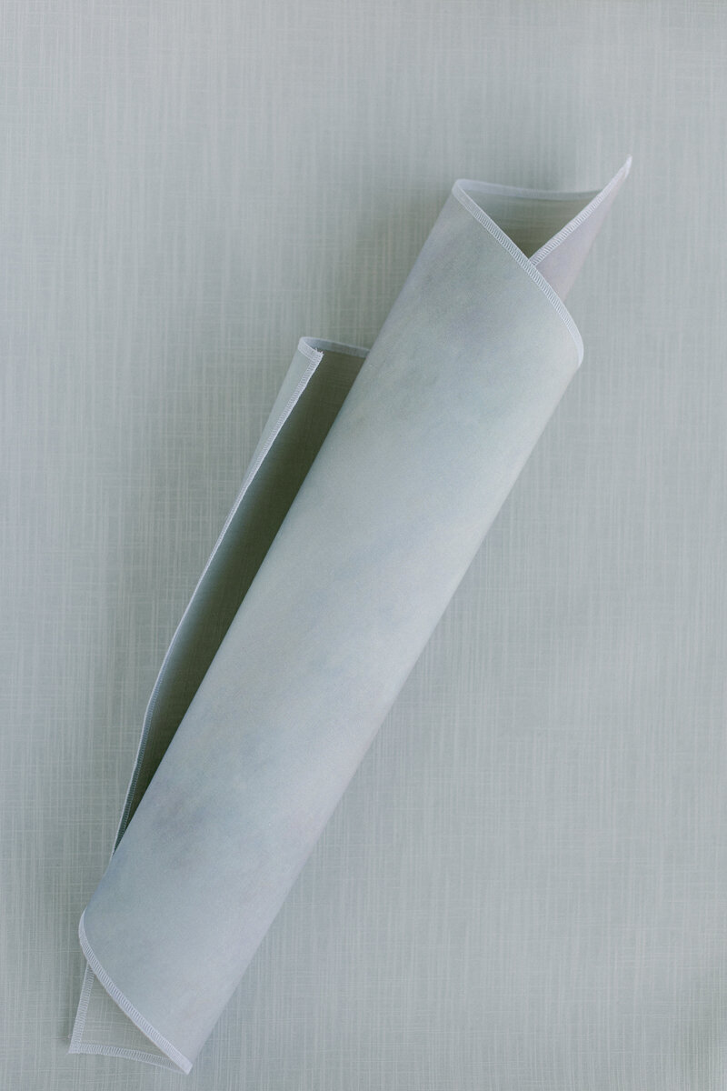 European linen mat for styling soft-toned wedding details and invitation suites