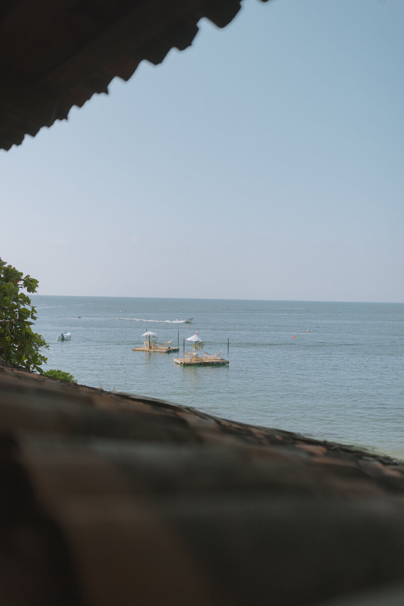 A stunning Mexican backdrop featuring white sand beaches, rolling waves, and vibrant greenery, capturing the essence of a romantic destination wedding.